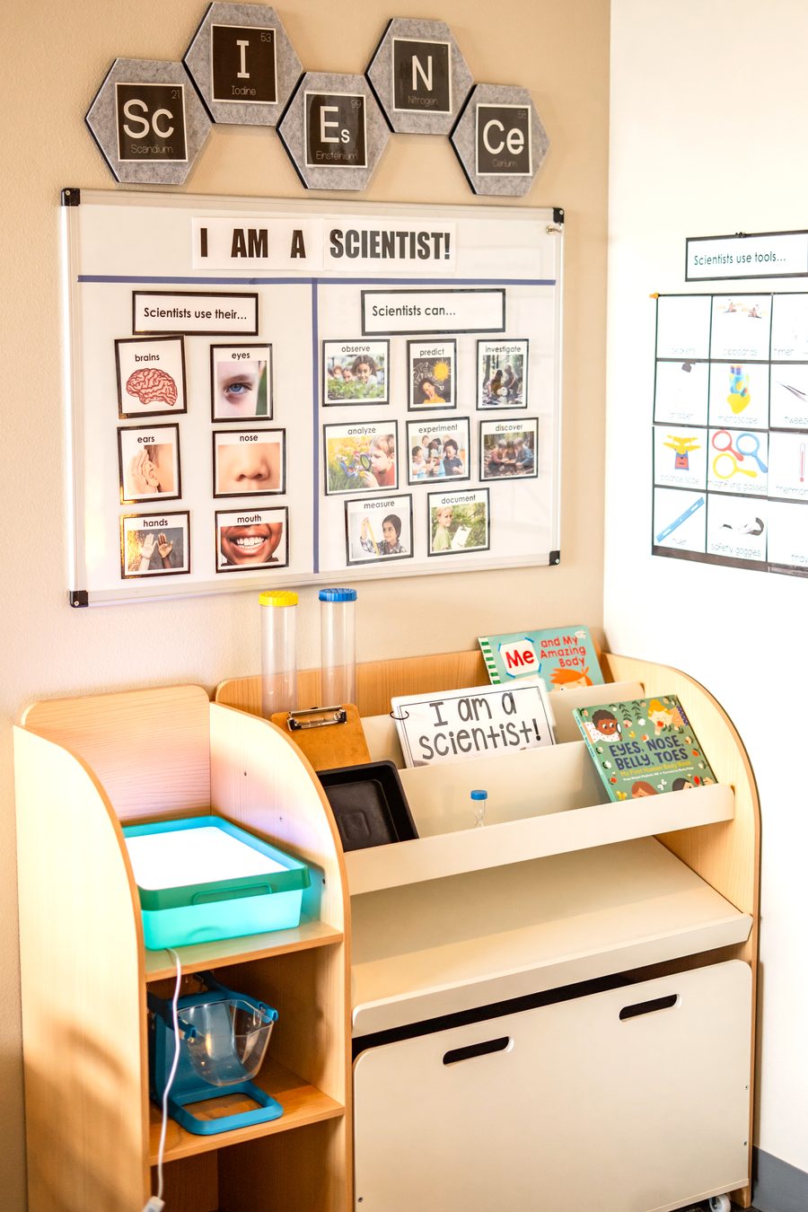 The science station at Hope Kids Preschool with an I Am A Scientist learning board and hands-on materials